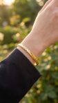 Use_the_gold_bracelet_from_202606301353 (1)