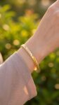 Use_the_gold_bracelet_from_202606301353 (1)